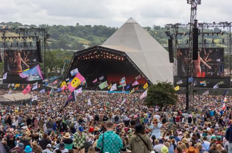 Large crowd at Glastonbury Festival in front of the Pyramid Stage.
