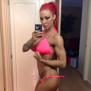 Jodie Marsh taking a selfie in a pink bikini.