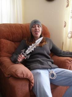 Handout photo of Joanna Dennehy's accomplice holding a knife and handcuffs.