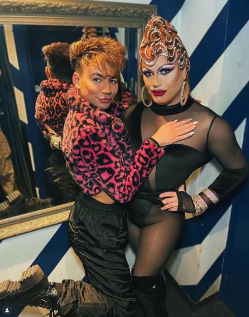 Sam Ashby posing with a drag queen.