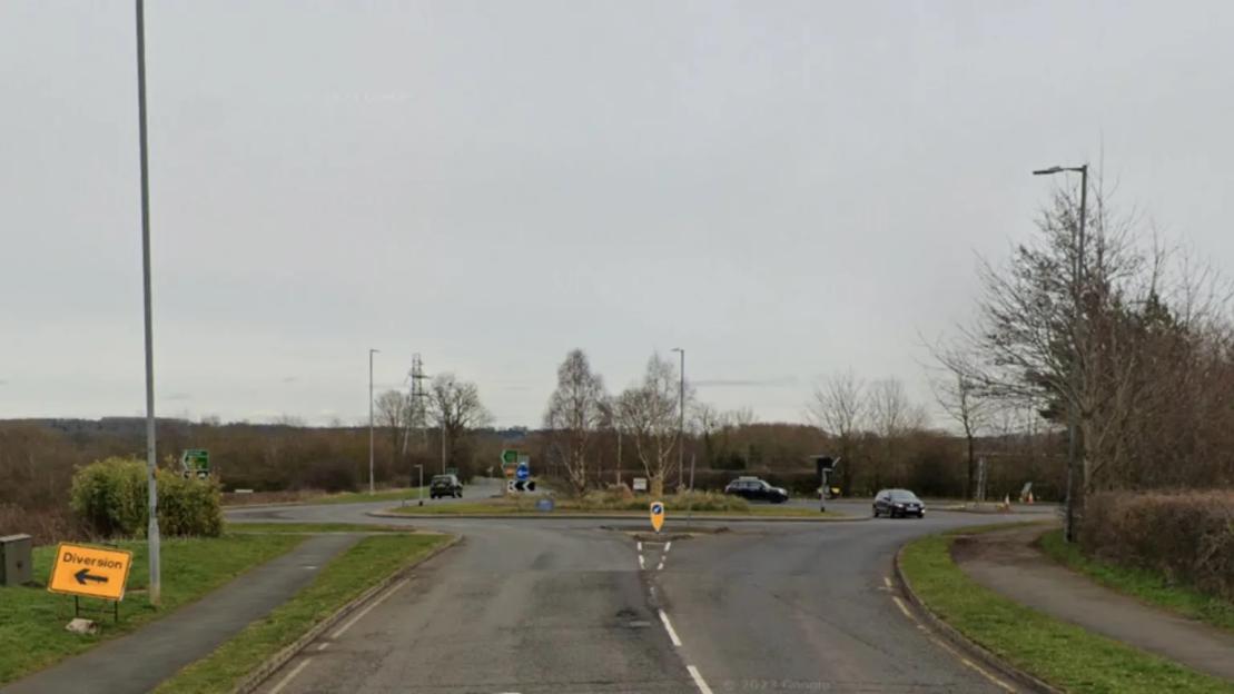 A6003 Stamford Road roundabout with a diversion sign.