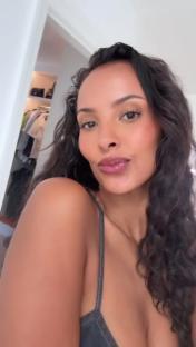 Maya Jama in a denim dress.