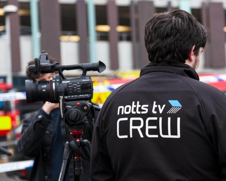 Notts TV crew member with camera.