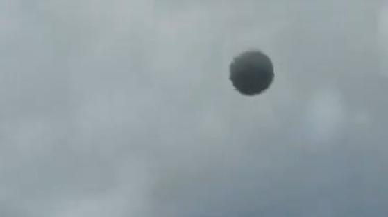 Sphere-shaped UFO in the sky.