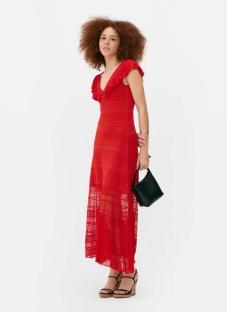 Woman in red summer dress and black sandals.