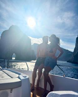 Couple on a boat in Amalfi Coast.