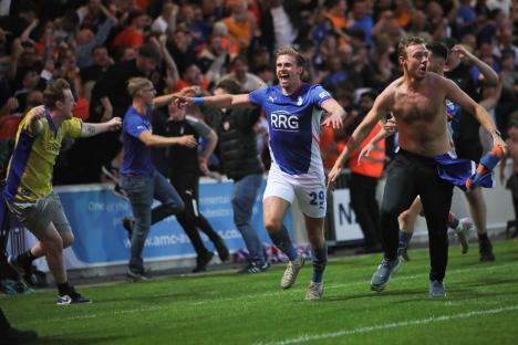Oldham Athletic player celebrating a goal.
