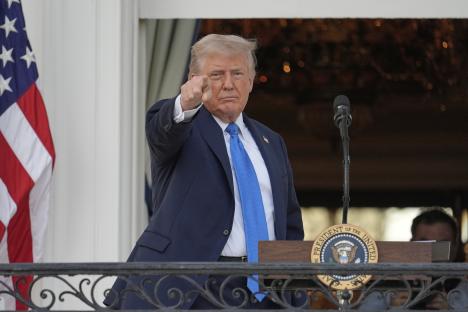 President Donald Trump speaking and gesturing.
