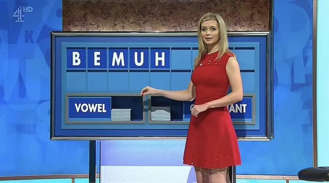 Countdown game show host selecting a vowel.