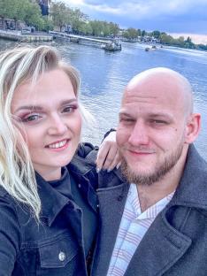 Selfie of a couple by a river.