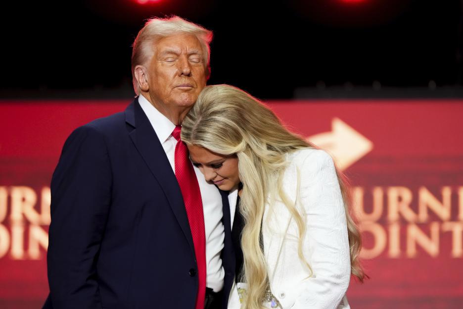 President Donald Trump hugs Erika Kirk at a memorial for her husband, conservative activist Charlie Kirk.