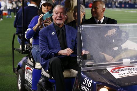 Jim Irsay, owner of the Indianapolis Colts, riding in a golf cart before an NFL game.