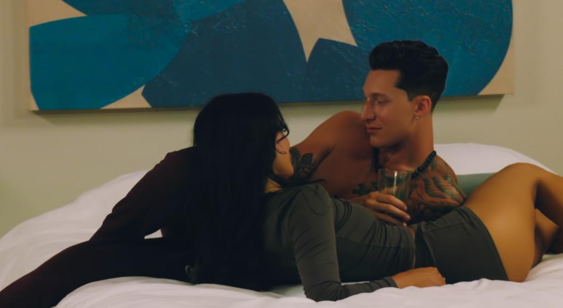 Couple lying in bed together.