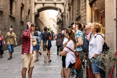 Barcelona, Spain - September 3, 2023. tourist guide with tourists making a tour of the gothic quarter of Barcelona