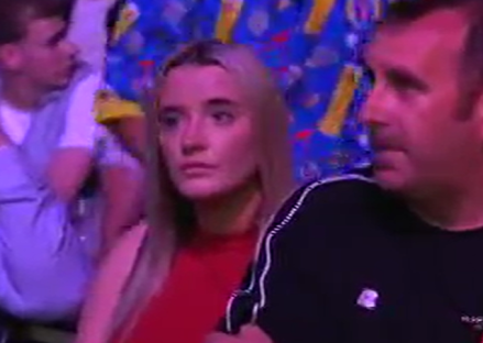 Woman and man sitting next to each other.
