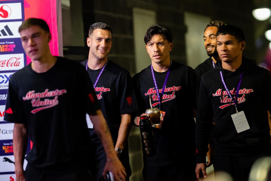 Manchester United players arriving at a match.