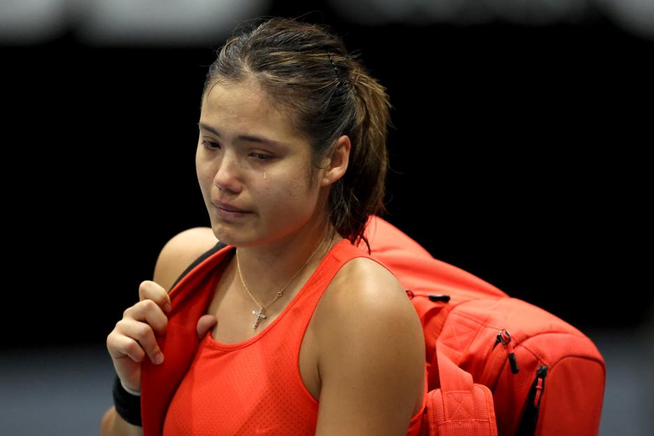 Emma Raducanu crying after withdrawing from a tennis match due to injury.