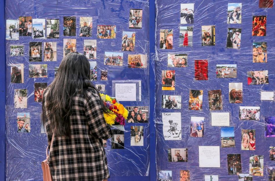 Memorial of photos and messages for a young woman.