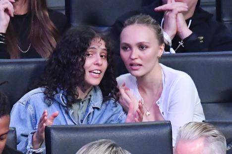 Lily-Rose Depp and 070 Shake at a basketball game.