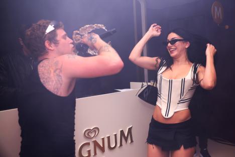 Yung Lean and Charli XCX on stage at a party.