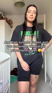 Woman regretting the placement of her elephant tattoo that resembles a penis in summer clothing.