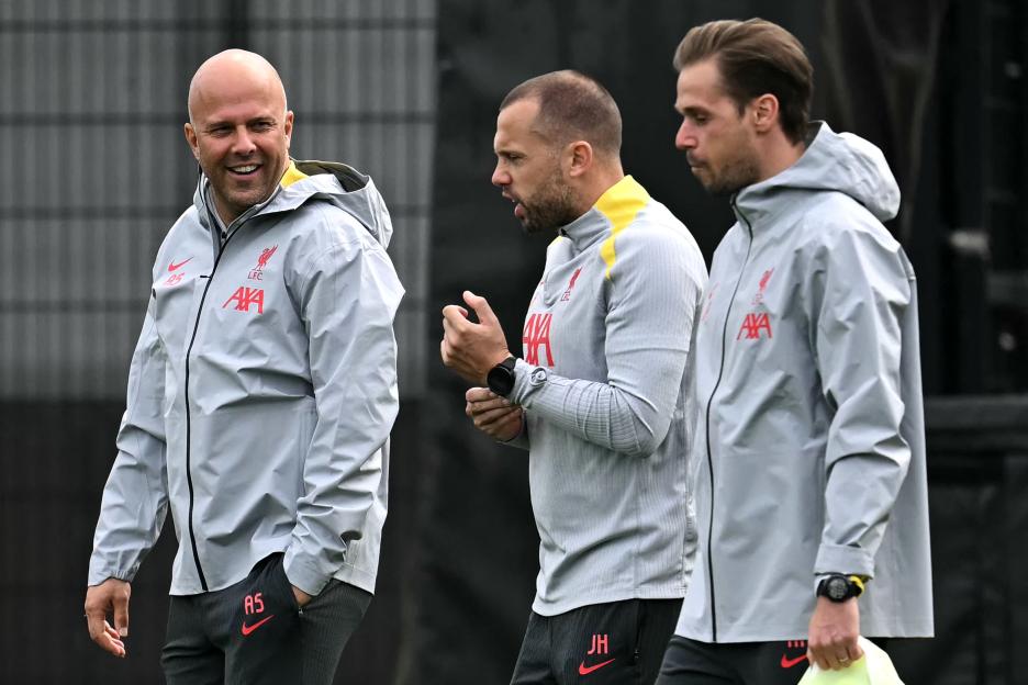 Liverpool's manager Arne Slot and assistant manager Johnny Heitinga at a training session.