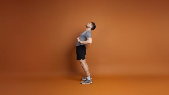 Man performing a back extension exercise.