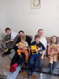 Family portrait on a couch.