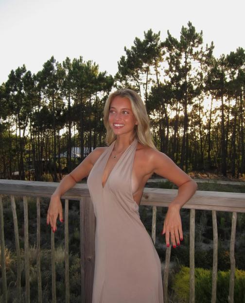 Margarida Corceiro, Lando Norris' girlfriend, in a beige halter dress.