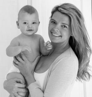 Black and white photo of a mother holding her baby.