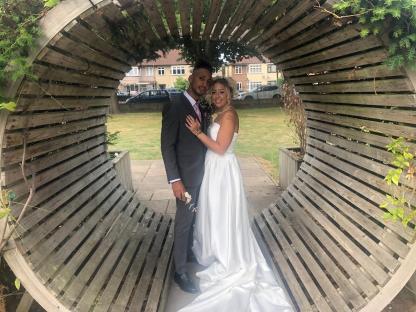 Amy and Claude, from the Open House series 3, posing for a wedding photo.