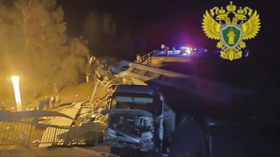 Rescue workers at the site of a train derailment in Bryansk, Russia.