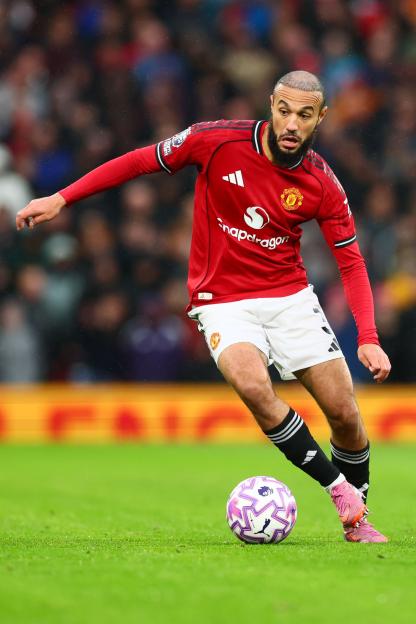 Noussair Mazraoui of Manchester United playing football.