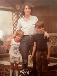 Photo of a woman with her two sons.