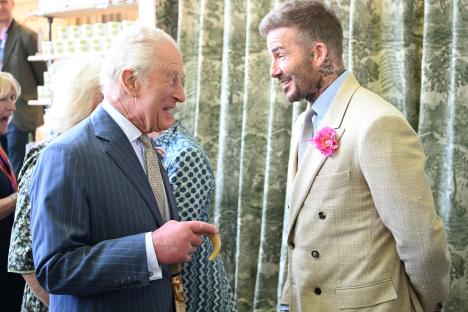 King Charles and David Beckham conversing at the RHS Chelsea Flower Show.