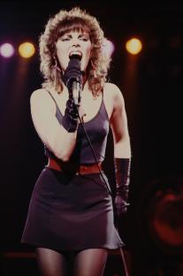 Pat Benatar performing on stage.