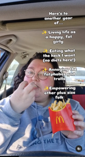 Woman eating french fries in a car, celebrating another year of body positivity.