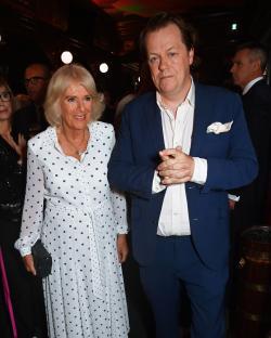 Queen Camilla and Tom Parker Bowles at a book launch.