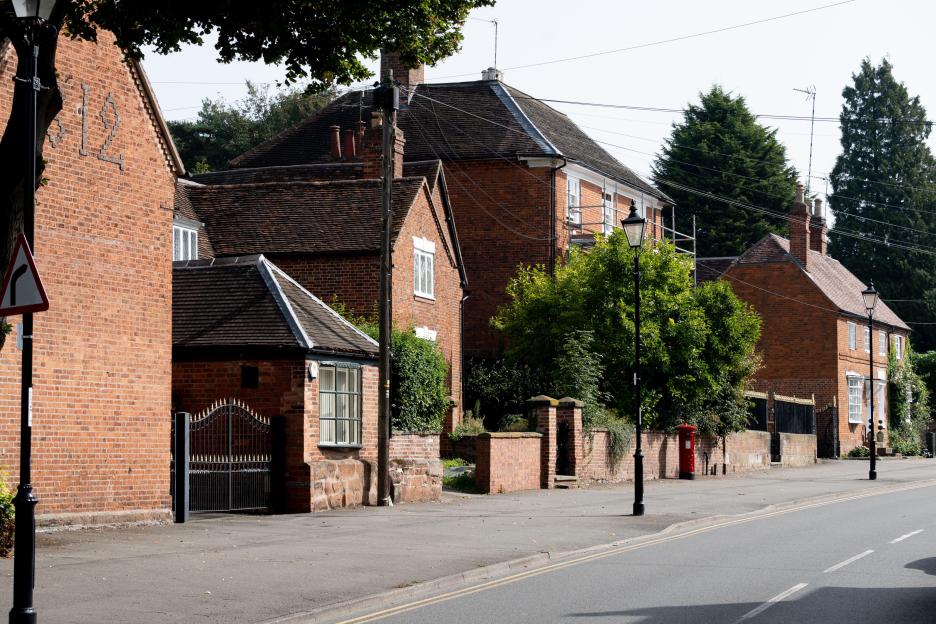 Brick houses and a street scene in Allesley village, West Midlands.