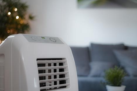 Portable air conditioner in a living room.