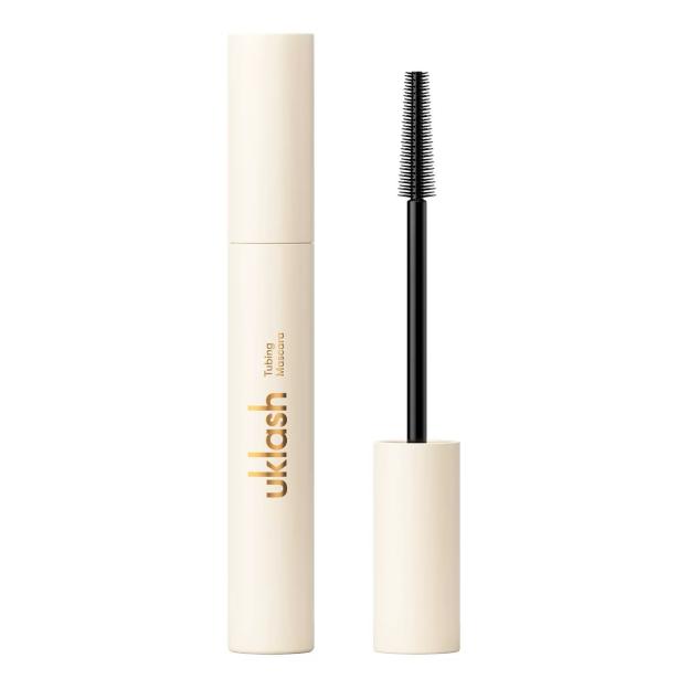 Uklash Tubing Mascara in a light-colored tube with the wand pulled out.