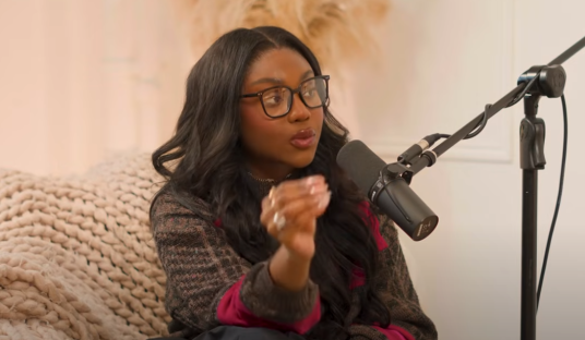 Whitney from Love Island speaking into a microphone.