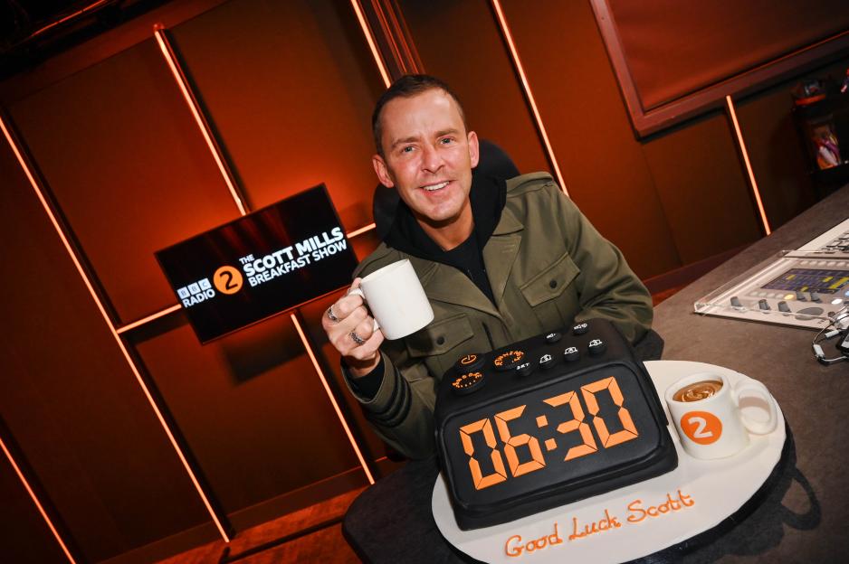 Scott Mills with a clock cake for his new BBC Radio 2 Breakfast Show.