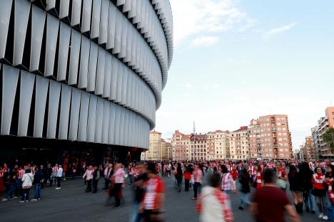 Fans outside a stadium before a soccer match.