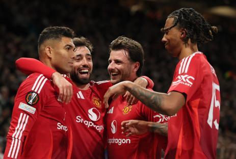 Manchester United players celebrating a goal.