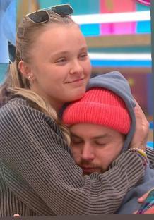 JoJo Siwa hugging Chris Hughes.