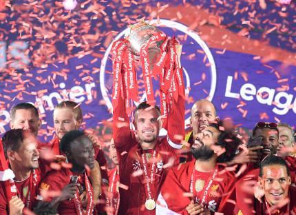 Liverpool F.C. players celebrating Premier League victory.
