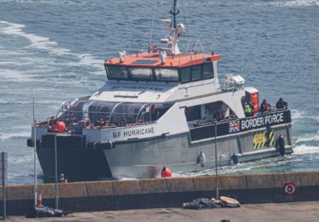 British Border Force vessel BF Hurricane arriving at port with migrants.