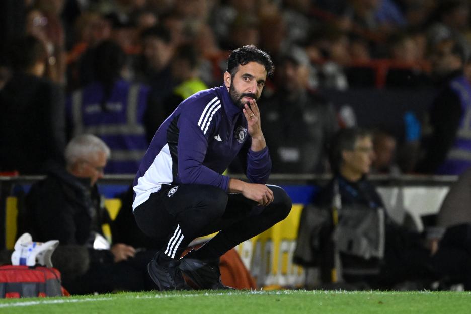 Ruben Amorim, Manchester United manager, looks dejected on the sidelines.