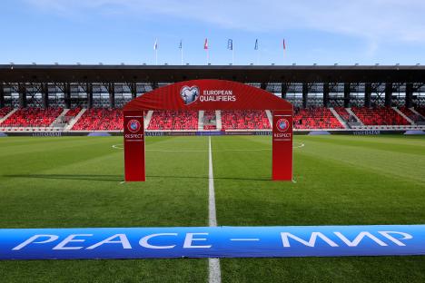Empty soccer stadium before a UEFA Euro 2024 qualifier match.